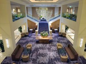 an overhead view of a lobby with a table and stairs at Hilton Los Angeles Airport in Los Angeles