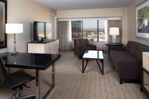 a living room with a couch and a table at Hilton Los Angeles Airport in Los Angeles