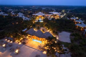 an aerial view of a resort at night at Indura Beach & Golf Resort Curio Collection By Hilton in Tela