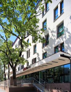 a building with a staircase in front of it at Hampton By Hilton Bialystok in Białystok