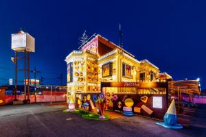 a building that is lit up with christmas lights at SWEETS HOTEL KYOTO -Adult Only in Yawata
