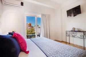 Postel nebo postele na pokoji v ubytování Hotel Suites Mar Elena