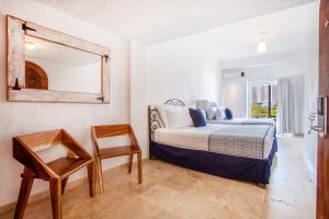 Postel nebo postele na pokoji v ubytování Hotel Suites Mar Elena