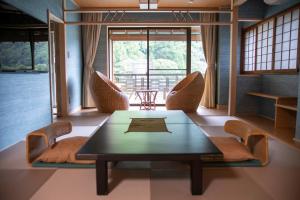 a dining room with a table and chairs at Senkei in Hakone