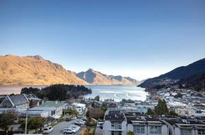 an aerial view of a city and a body of water at The Carlin Boutique Hotel in Queenstown