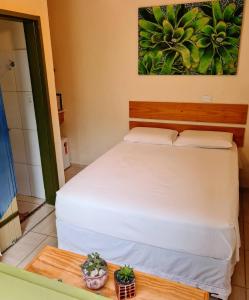 Cama o camas de una habitación en Praia Suítes Itagua Ubatuba