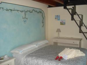 Postel nebo postele na pokoji v ubytování B&B I fiori di Marianna