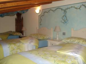 Postel nebo postele na pokoji v ubytování B&B I fiori di Marianna