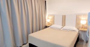 Posteľ alebo postele v izbe v ubytovaní Pacifico Apartment