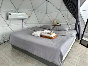 Style Paidoi Resort客房内的一张或多张床位