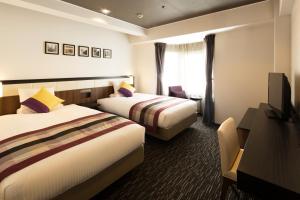 Katil atau katil-katil dalam bilik di HOTEL MYSTAYS Shinsaibashi