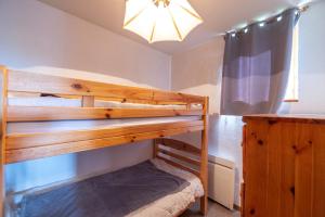 Ένα ή περισσότερα κρεβάτια σε δωμάτιο στο Appartement 2 Pièces - Les Saisies