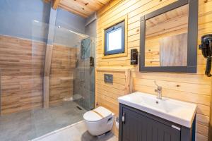 a bathroom with a toilet and a sink and a shower at Aronia Bungalow in Elmalık +36 photos