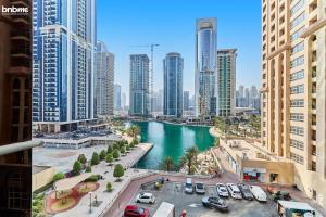 a view of a river in a city with tall buildings at bnbmehomes - Cozy modern JLT flat next to metro - 405 in Dubai