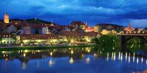 a view of a city with a bridge over a river at Apartma4us in Maribor