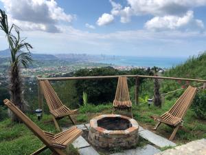 two chairs and a fire pit on top of a hill at Silent Hill მშვიდი გორა in Batumi