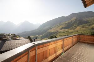 a balcony with a view of a mountain at Sillur 2 - Apartment in Innerarosa in Arosa