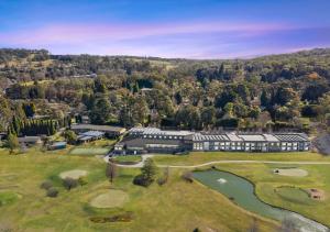 an aerial view of a building with a golf course at Park Proxi Gibraltar Bowral in Bowral