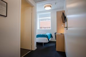 TV a/nebo společenská místnost v ubytování Severin Kursuscenter og Konferencehotel