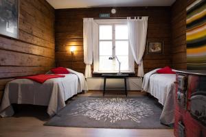 מיטה או מיטות בחדר ב-Possakkatupa