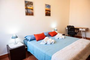 a bedroom with a bed with towels on it at Ferrara center - Luxury apartment in medieval area with Wi-Fi in Ferrara