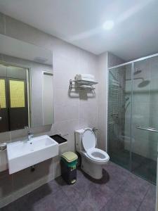 a bathroom with a sink and a toilet and a shower at Wanz Barakah Homestay @ Bali residence in Malacca