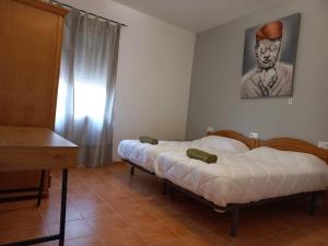 Ein Bett oder Betten in einem Zimmer der Unterkunft ECORESORT LOS SUEÑOS DEL JÚCAR Complejo la Fuente