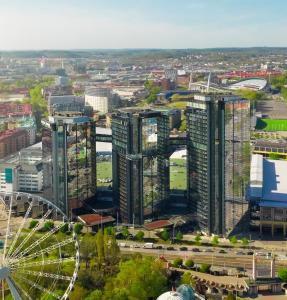 an aerial view of a city with a ferris wheel at Gothia Towers & Upper House in Gothenburg