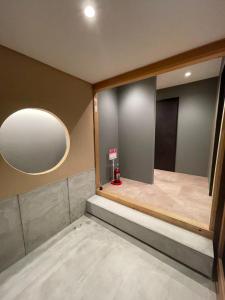 a dressing room with a large mirror on the wall at the terrace sumoto - Vacation STAY 24588v in Sumoto