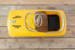 a yellow emergency car is sitting on a wooden floor at Espacio Natural in Valdemorillo