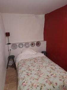 a bedroom with a bed with two lights on it at Sur le chemin in Auvillar