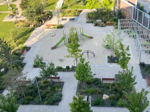 an aerial view of a playground with trees and benches at luxury apartment in Bratislava