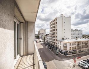 a view of a city street from a building at Voltaire Lion Suite - 5 min Hypercentre in Troyes