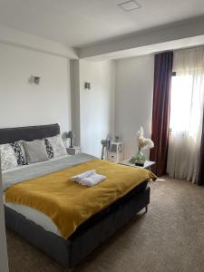 Łóżko lub łóżka w pokoju w obiekcie Garni hotel Niksic