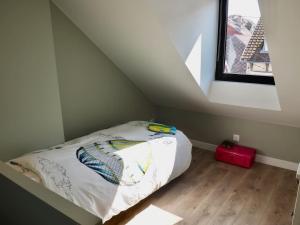 Un pat sau paturi într-o cameră la Belle Villa au Coeur du Touquet