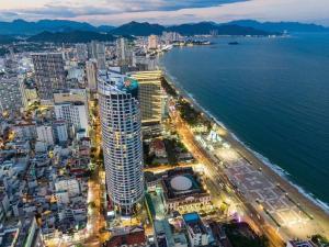 an aerial view of a city next to the ocean at SeaScape Panorama Grand Resicedences Nha Trang in Nha Trang