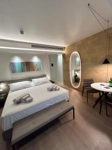 מיטה או מיטות בחדר ב-Palazzo Sangiorgio