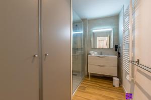 a bathroom with a shower and a sink at MY Hôtel Résidences - La Grande-Motte in La Grande Motte +74 photos