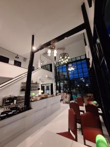 a kitchen and dining room with chairs and a table at The Courtyard Chiangrai in Chiang Rai