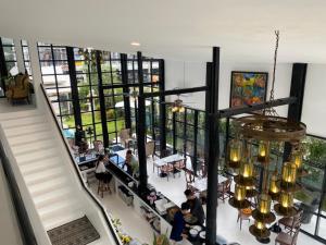 an overhead view of a restaurant with people sitting at tables at The Courtyard Chiangrai in Chiang Rai