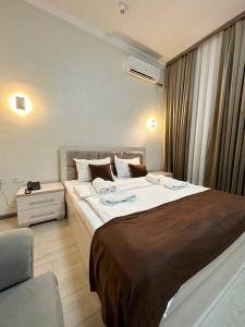 Tempat tidur dalam kamar di Izza Palace FAST WI-FI 120 MBPS