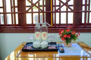 a tray with two bottles on a table at SEVEN HOMESTAY(HUE) in Hue +46 photos