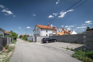 a car parked on the side of a street at Apartments By Pyramid: Elisabeth in Bratislava