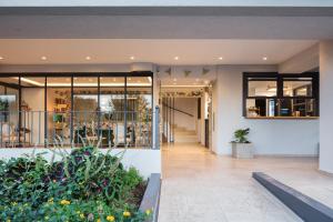 a view of the front of a building with plants at Lines Concept Accommodation in Rethymno Town