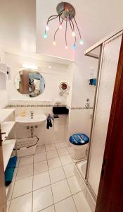 a bathroom with a sink toilet and a mirror at Wohlfühl & Wellness Oase in Neustadt an der Weinstraße +31 photos