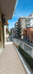 a walkway in a city with buildings in the background at Vela Latina in Soverato Marina