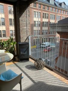 a balcony with a view of a parking lot at Luxury City Seafront Apartment with Balcony in Helsinki