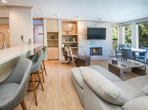 a living room with a couch and a fireplace at Gateway Plaza R4 Condo in Vail