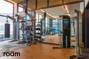 a gym with cardio equipment in a building at ViiA Residences Kuala Lumpur in Kuala Lumpur