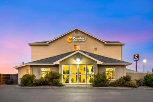 a building with a sign on the front of it at Comfort Inn & Suites Redwood Country in Fortuna